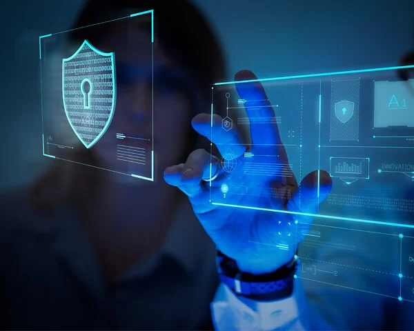 Hand touching a holographic screen with a padlock shield icon, illustrating cybersecurity for a hotel website