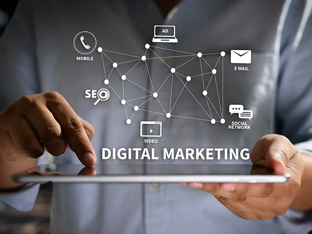 Hands on a tablet under a digital marketing network of mobile, SEO, ad, email, video and social icons