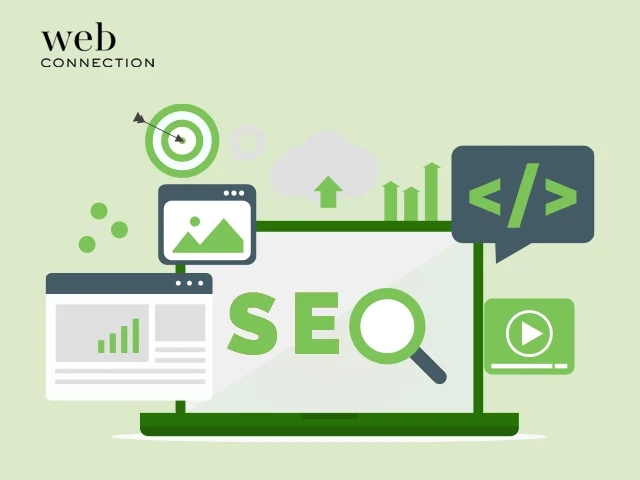 Laptop showing SEO with a magnifying glass, surrounded by target, code, video and rising chart icons