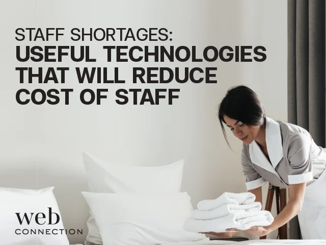 Hotel housekeeper in uniform placing folded white towels on a freshly made bed, under a headline on staff shortages