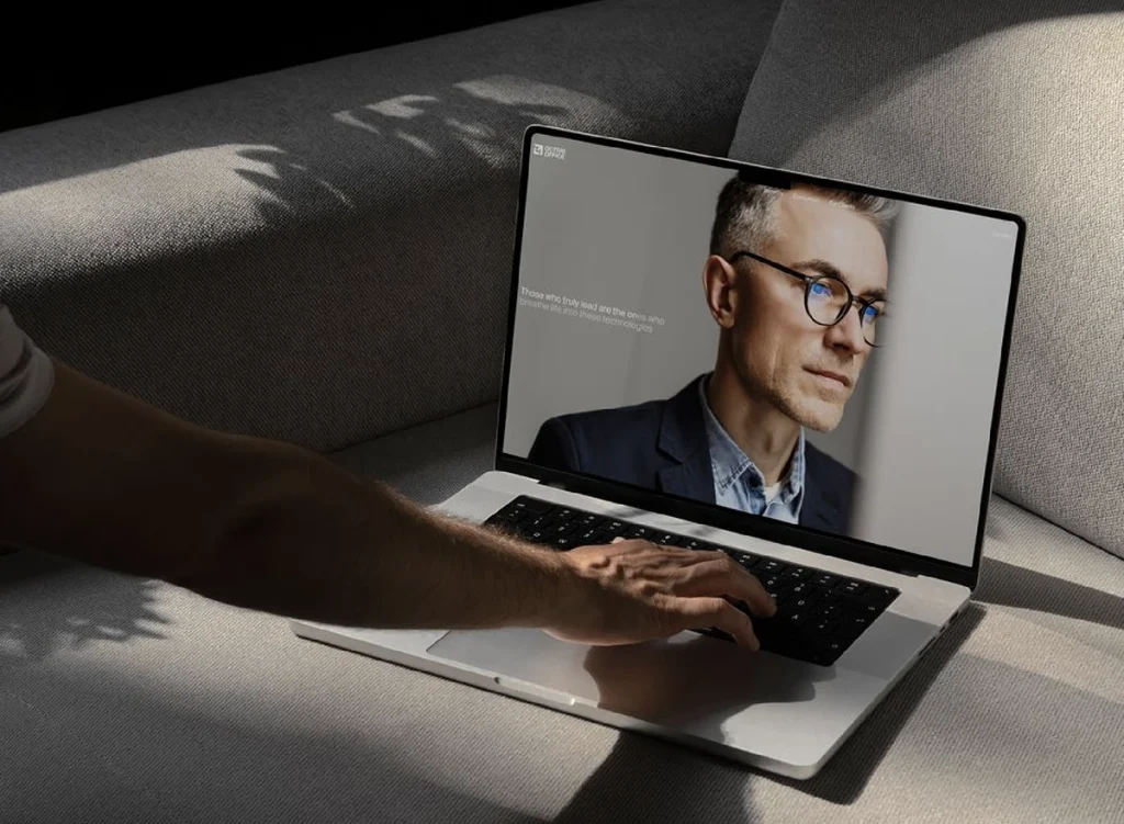 Hotel website on a laptop on a sofa