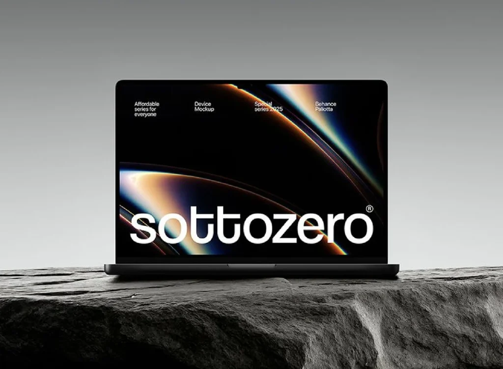 Website on a laptop standing on a stone ledge