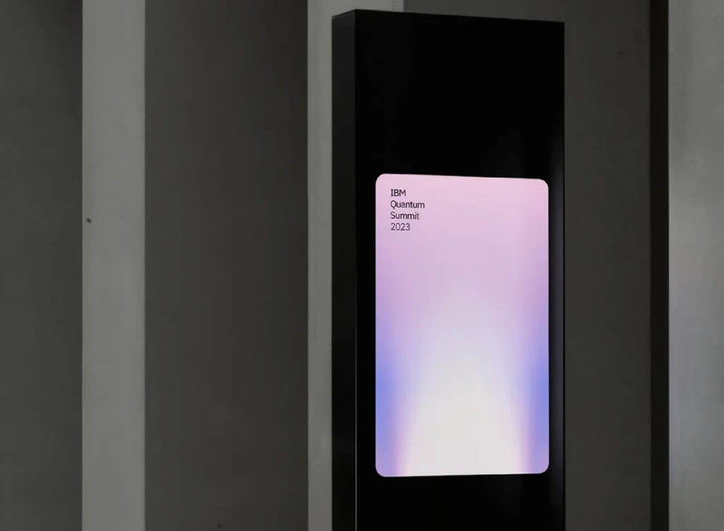 Digital signage screen in a dark lobby